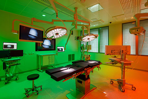 Operating room lit with red and green lights